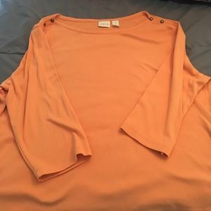 Chico’s orange shirt